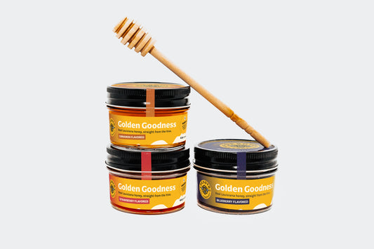Spring Sweetness Sampler with three 4 oz jars of Louisiana flavored honey and a wooden honey dipper